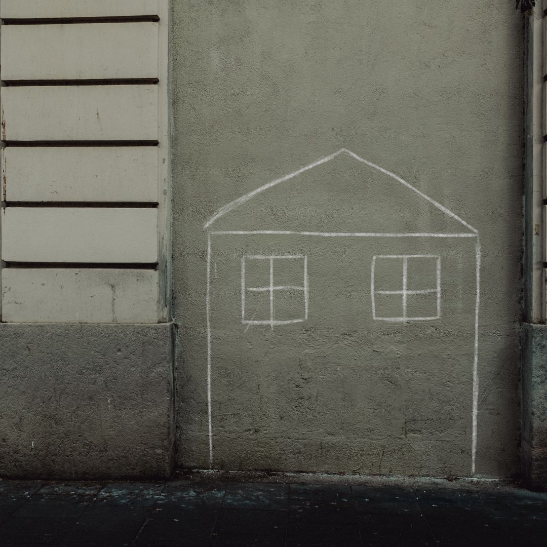 people holding a house